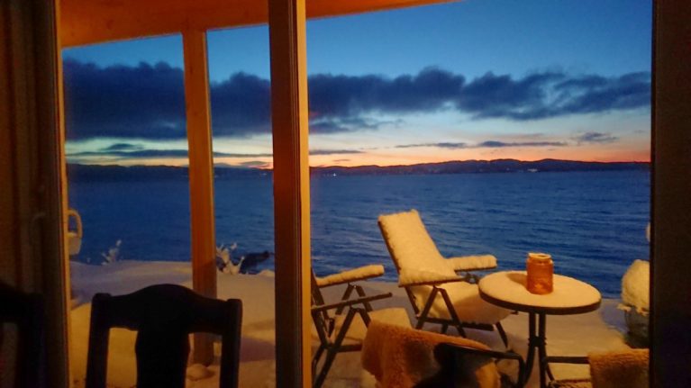 Evening photo with a view of the Trondheimsfjord from one of the holiday homes at Drivhussletta, at Hjellup Fjordbo in Leksvik.